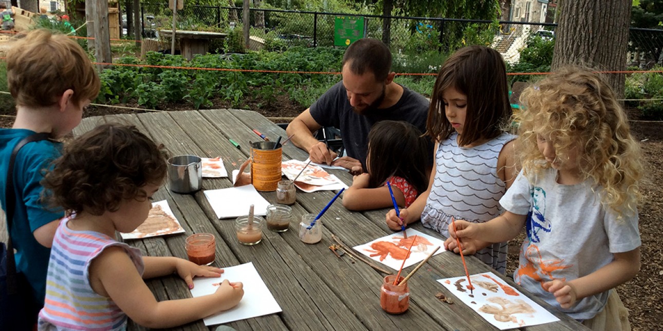 nature educator leads painting with clay activity