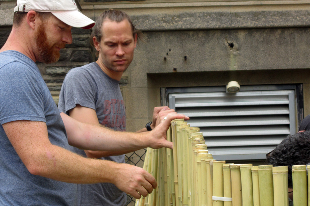 PIC dads install bamboo fence