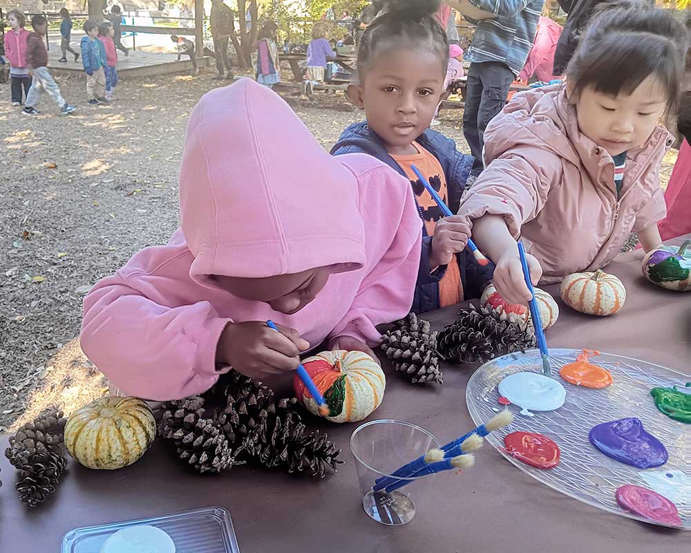 Fall Family Festival painting pumpkins