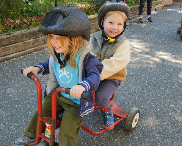 friends riding a trike