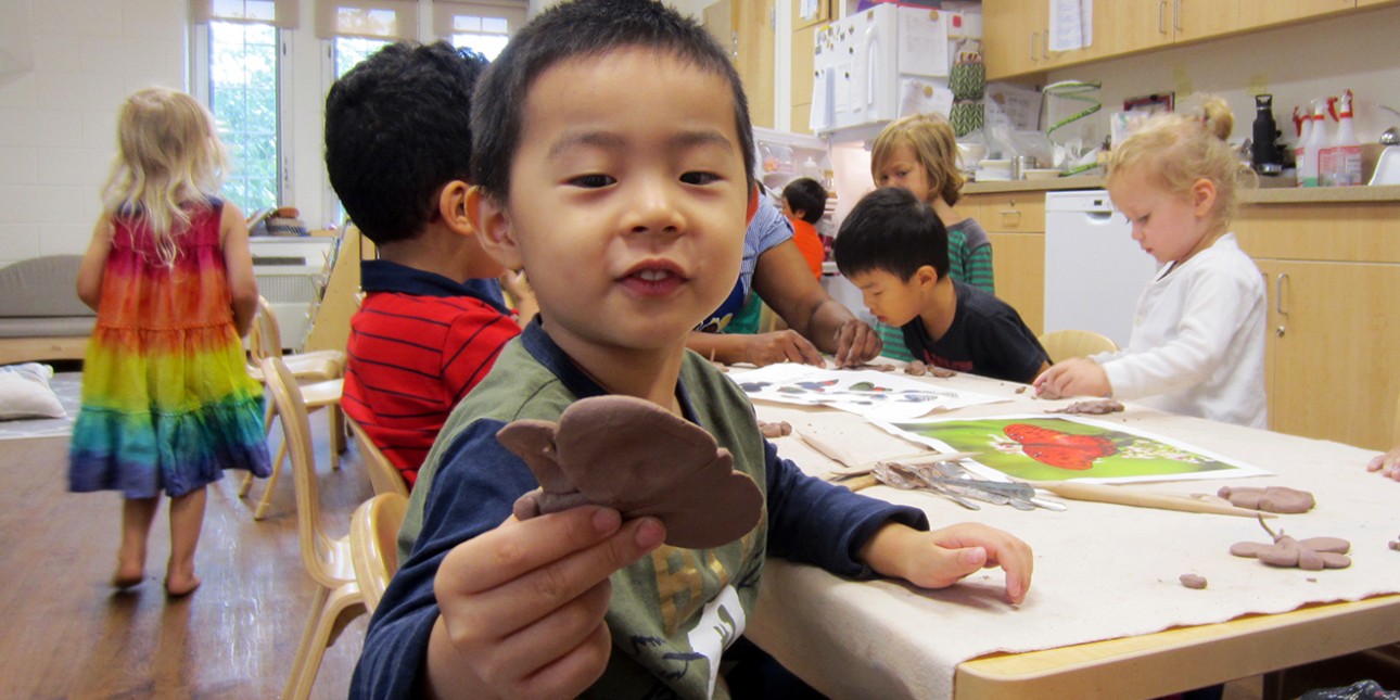 Preschoolers working with clay