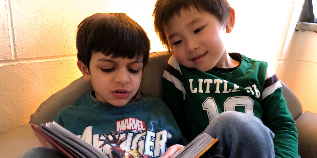 Preschoolers reading together