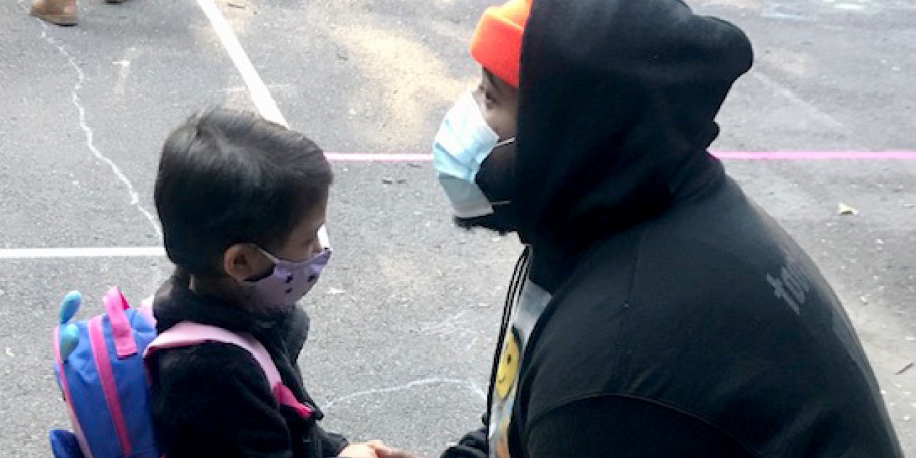Teacher caring for preschooler