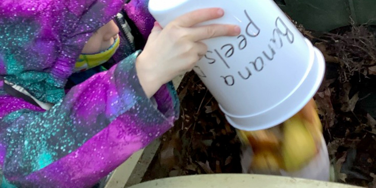 Preschooler composting at PIC