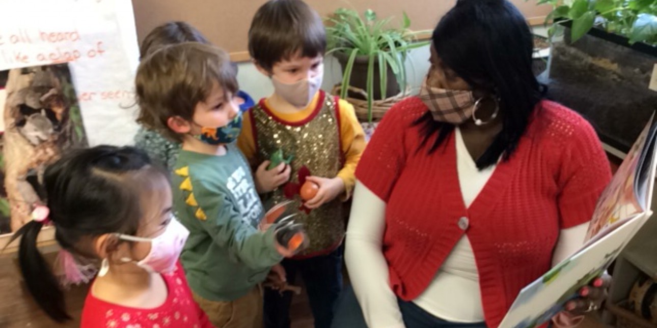 Teacher Diane reads in the Fireflies classroom