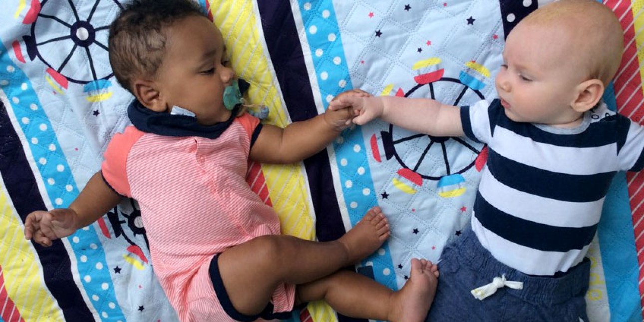 Baby buddies on a blanket