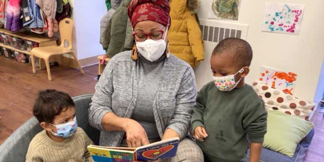 PIC teacher reads to toddlers
