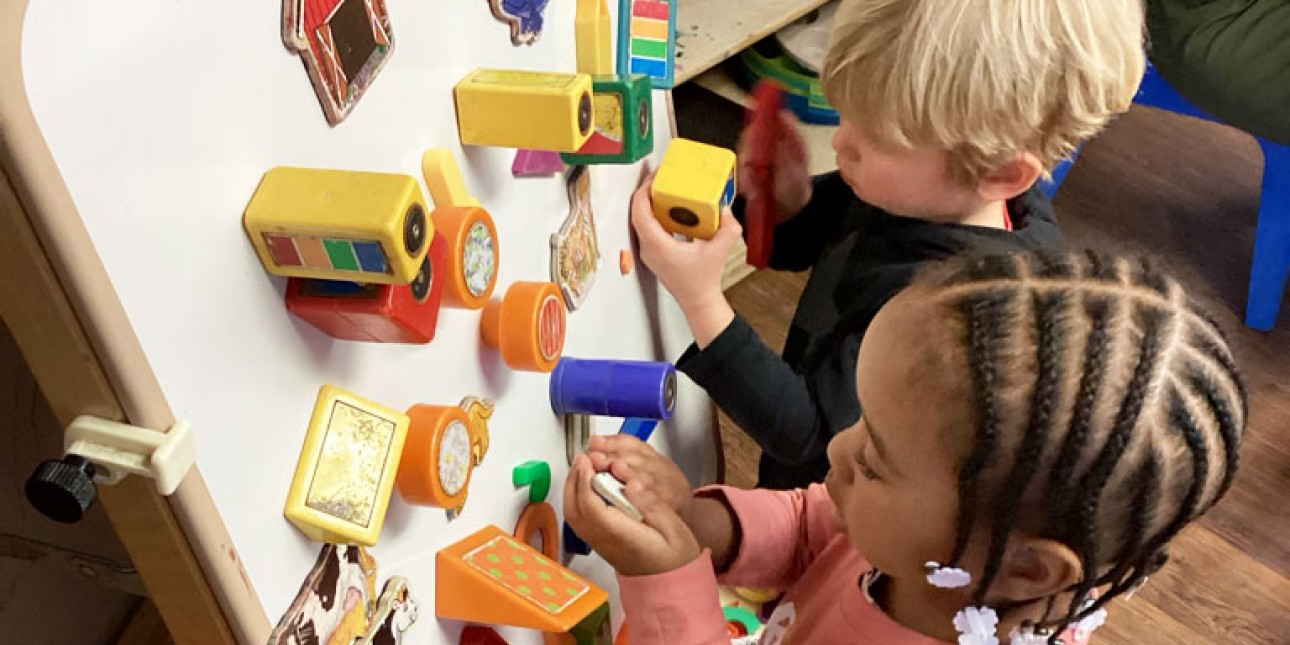 PIC toddlers at magnet board