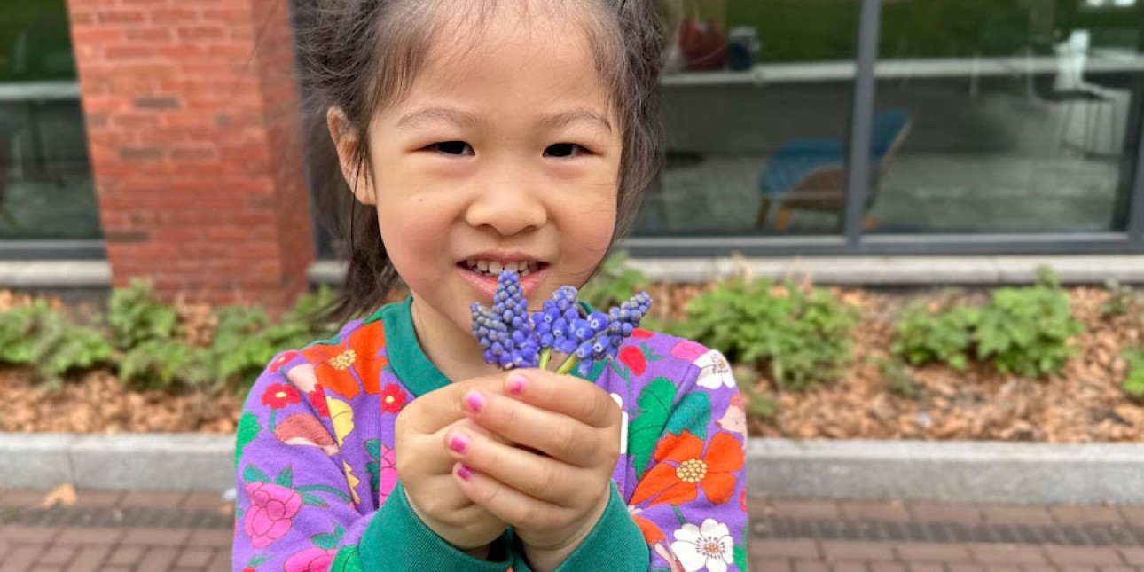 Child holding flowers