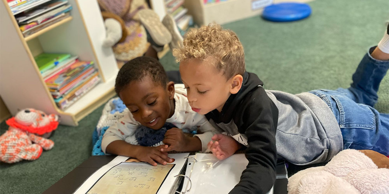 Preschoolers reading together