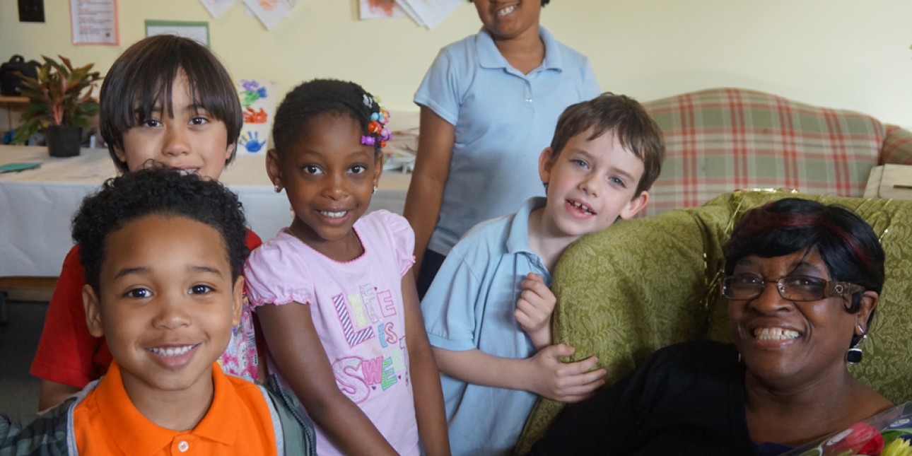 Charlotte Barnes with children at her retirement party