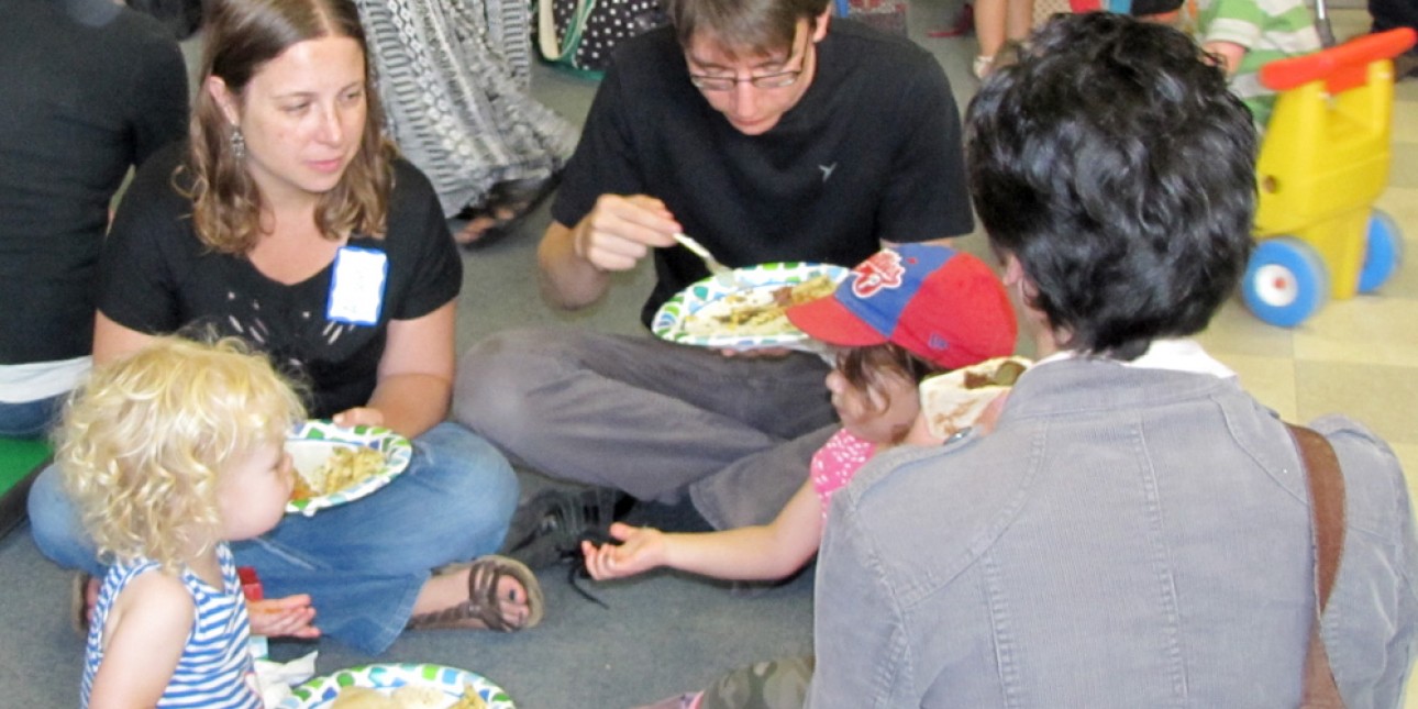 PIC families enjoy a potluck supper together