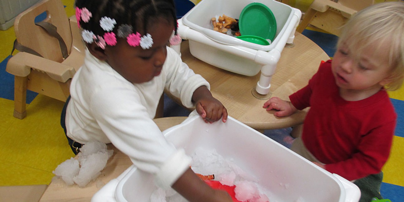 Young children engaged in sensory play