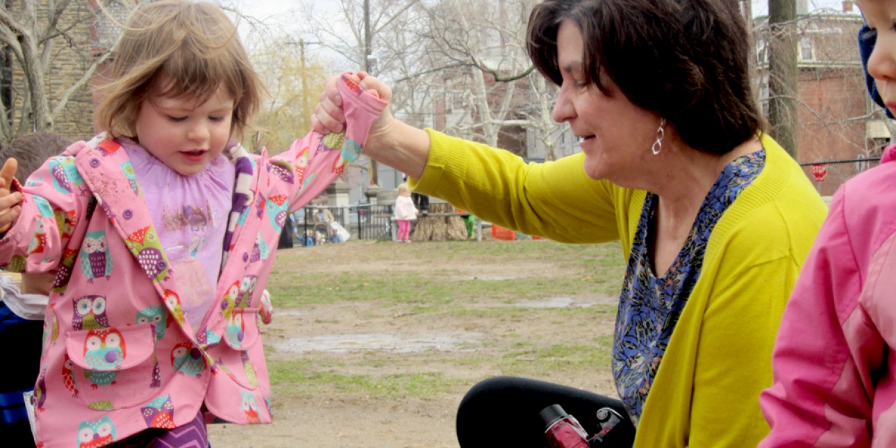 Deb Greenand child on the playground at PIC