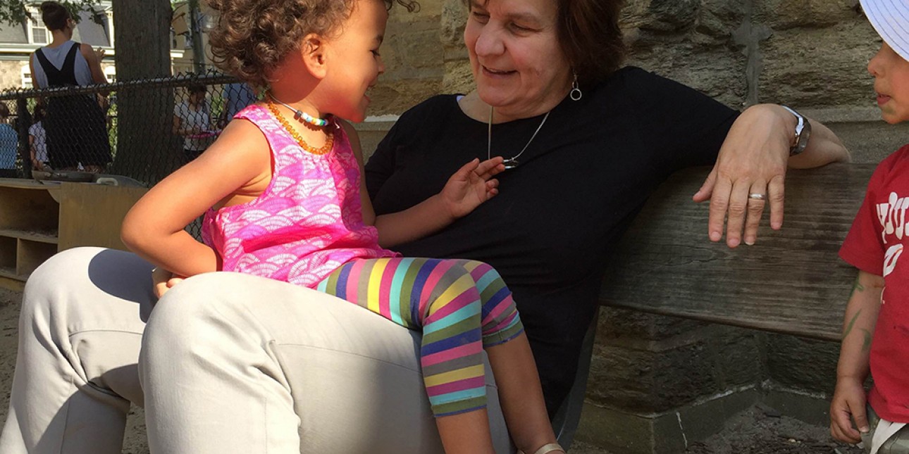 Deb Green on the playground with a PIC preschooler