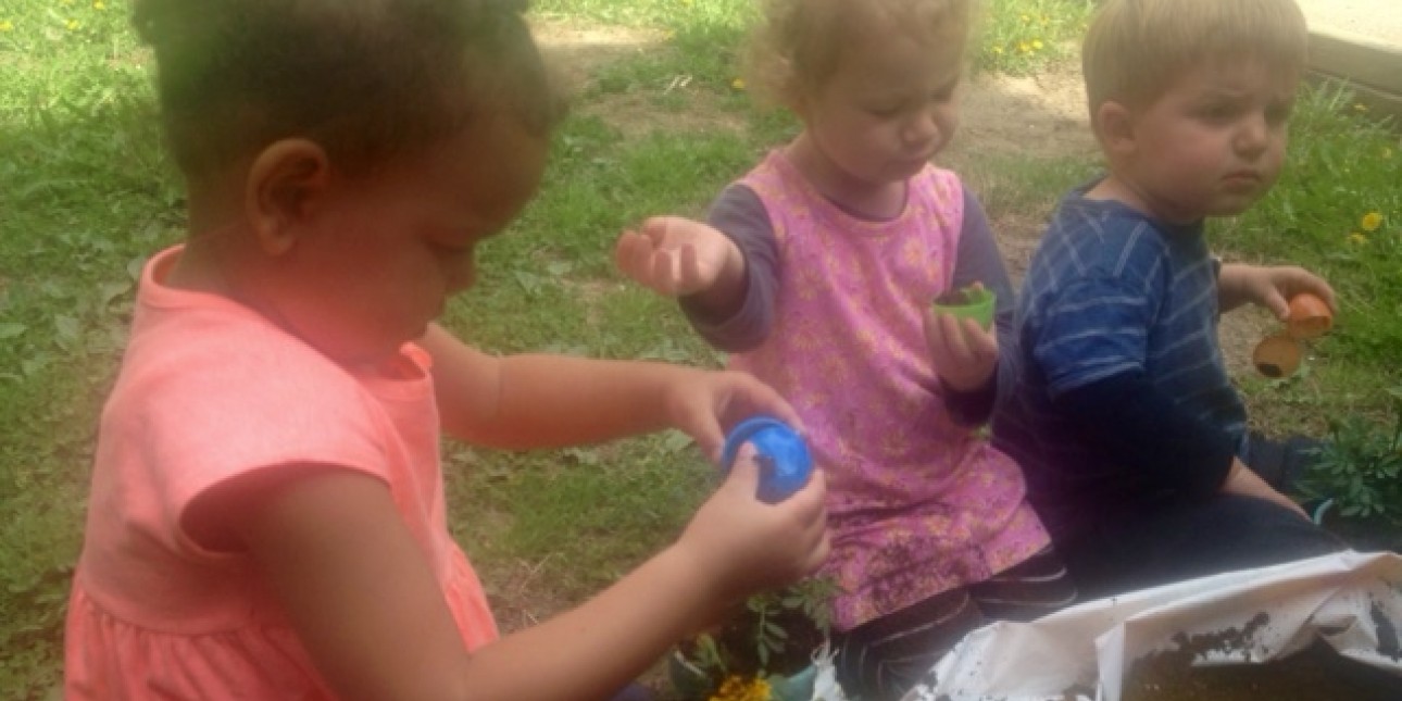 Rainbow experimenting with planting Kid Pots