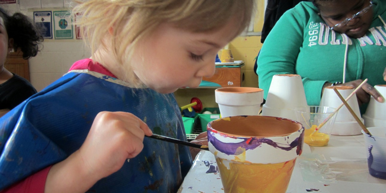 PIC preschooler painting a KidPot