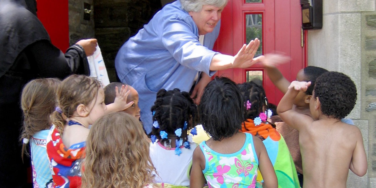 Marni Sweets high-fives PIC children